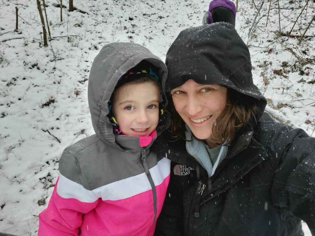 Elise and Amanda posing in the snow.
